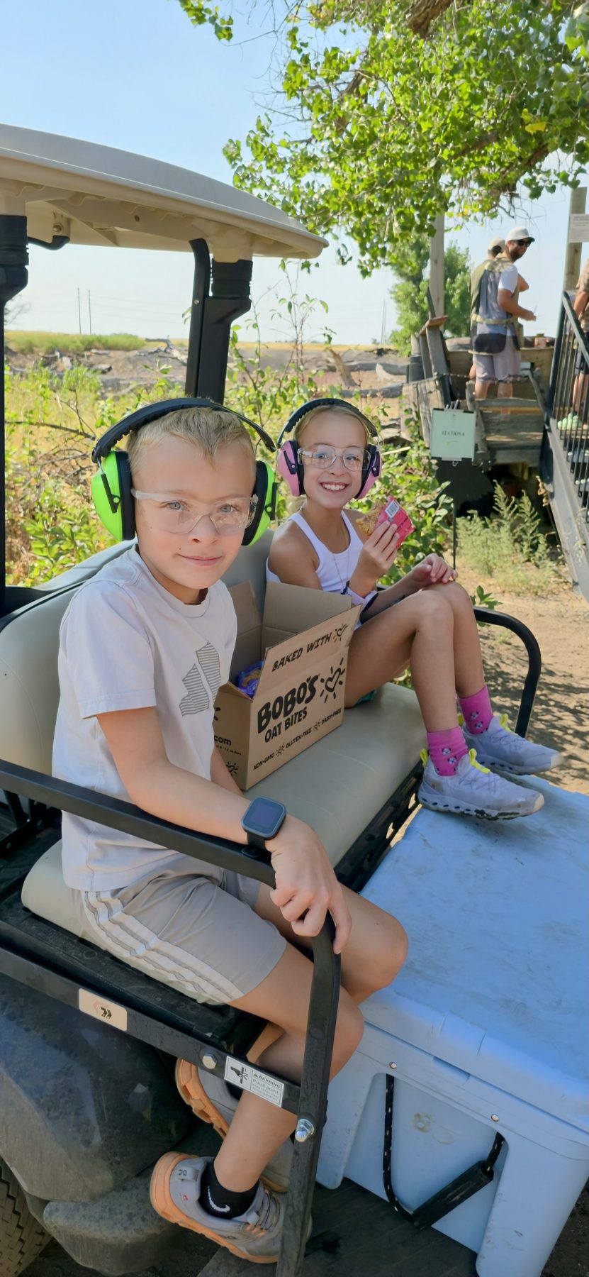 children in a golf cart