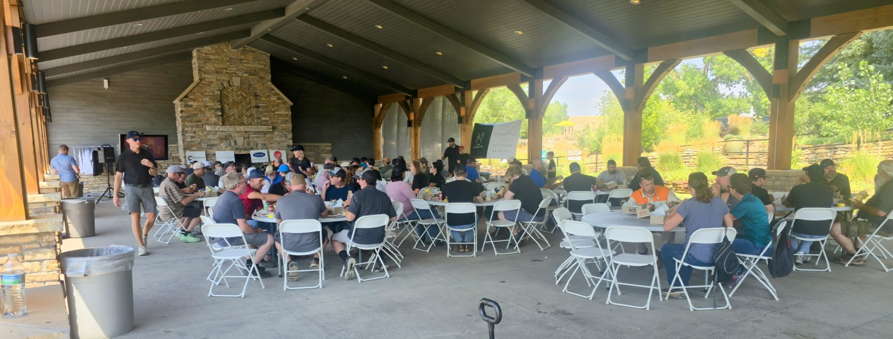 large group of people sitting at tables